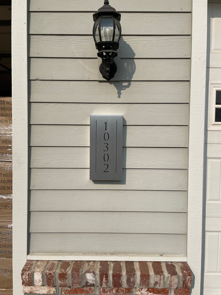 An illuminated Aluminum house sign that looks great during the day but truly shines at night with 46 LEDs and a dawn to dusk sensor -Brushed Aluminum